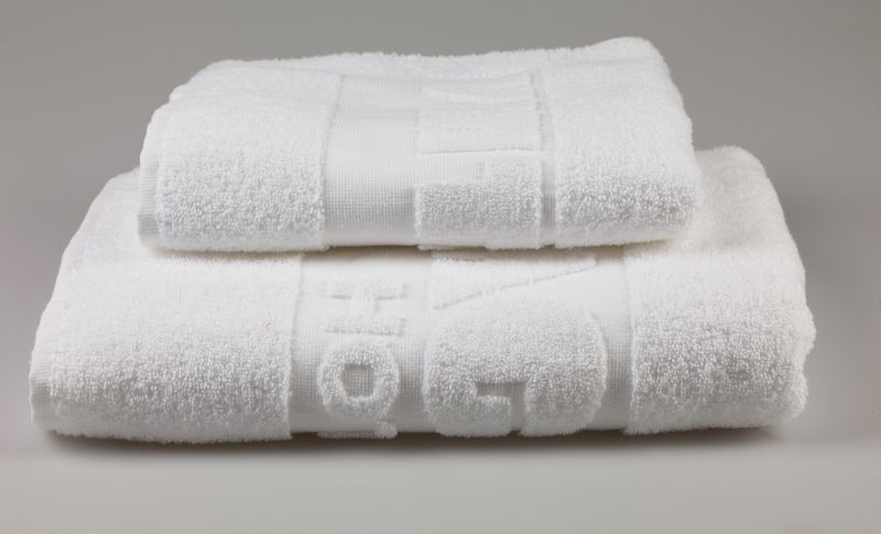 bath textiles with relief effect or embroidered name or logo